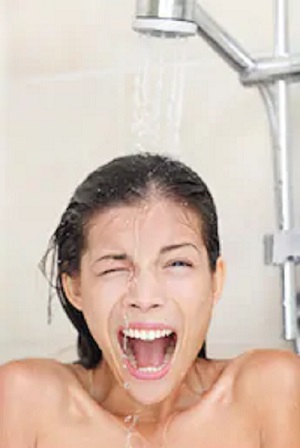 woman taking a cold shower