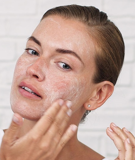 woman exfoliating