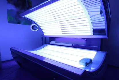 a top of the range tanning bed that is empty but turned on